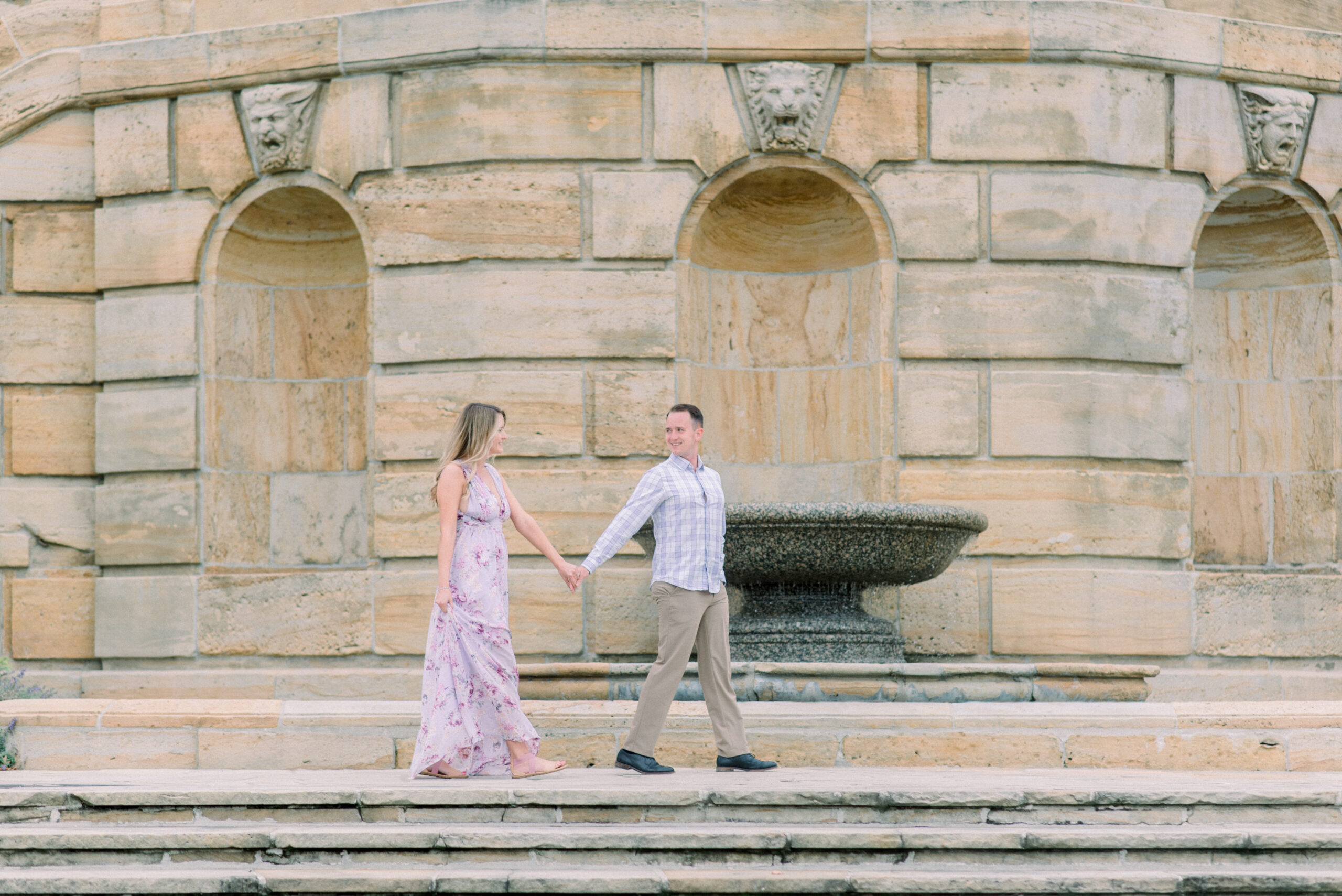couple at their engagement session outside the dayton art institute in dayton ohio